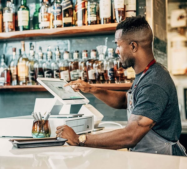 Payment-Processing-Man-at-Register-Bottles